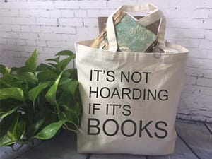 Not_Hoarding_Books Photo of a tote bag next to a plant