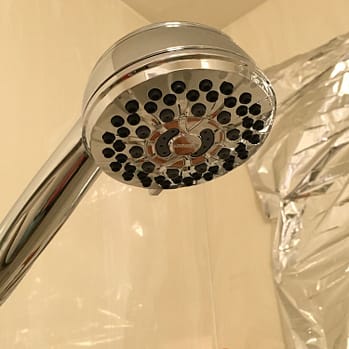 Nice shower head Photo of a round, chrome colored shower head and stalk