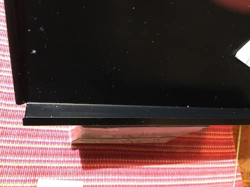 Document holder Edge Photo of a black document holder atop a tissue box