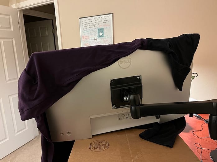 Back of monitor and arm Photo of the back of a monitor with a monitor arm partially attached