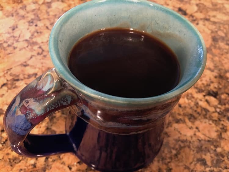 Ahh_coffee A cup of coffee in a blue and purple hand crafted mug